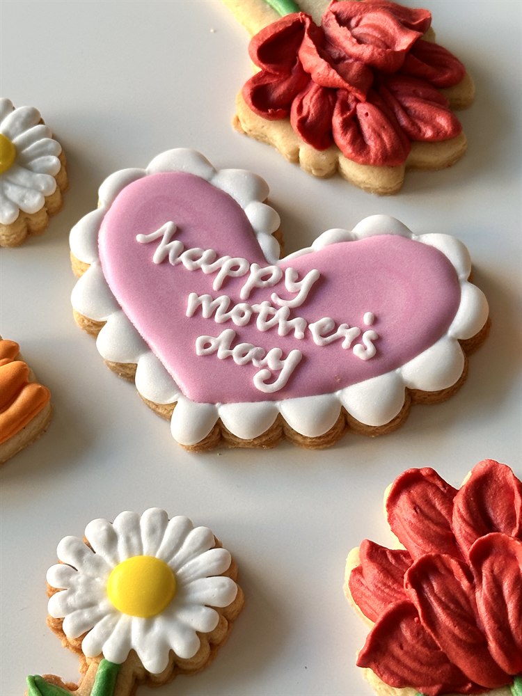 Hand-piped heart sugar cookie close-up