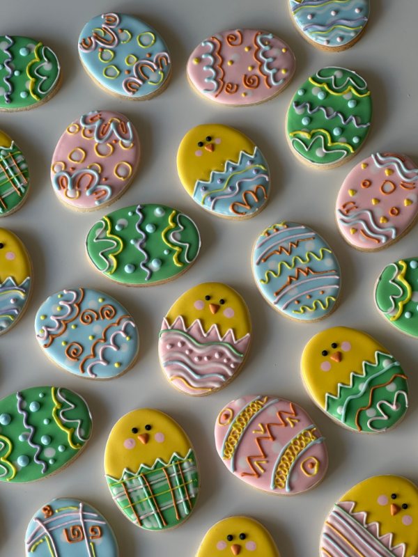 Easter egg cookies with hatching chicks in spring pastels