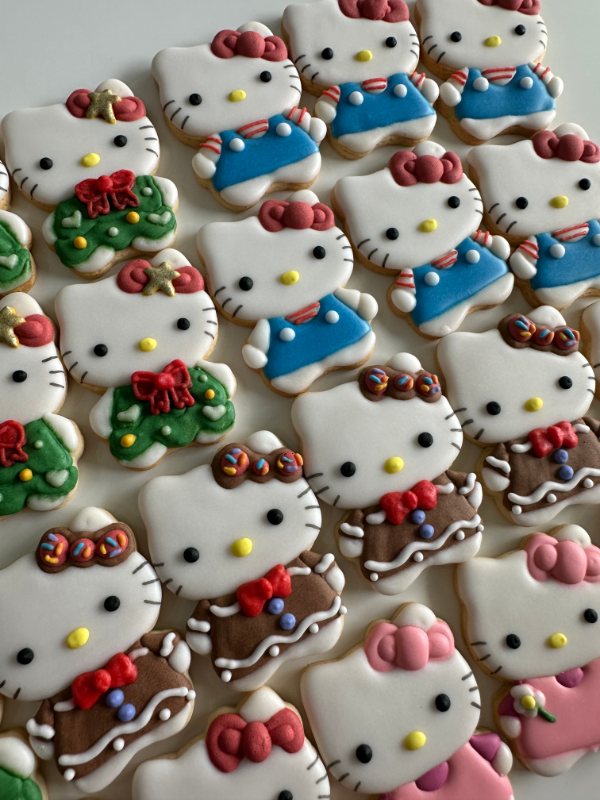 Holiday character cookies with bows, wreaths and gingerbread trims