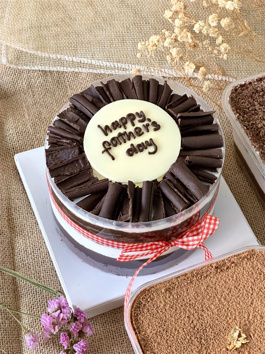 Black Forest acetate cake crowned with chocolate curls