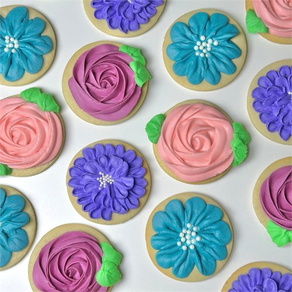 Flowers in Bloom — hand-piped royal icing rosettes and blooms in pink, blue and violet