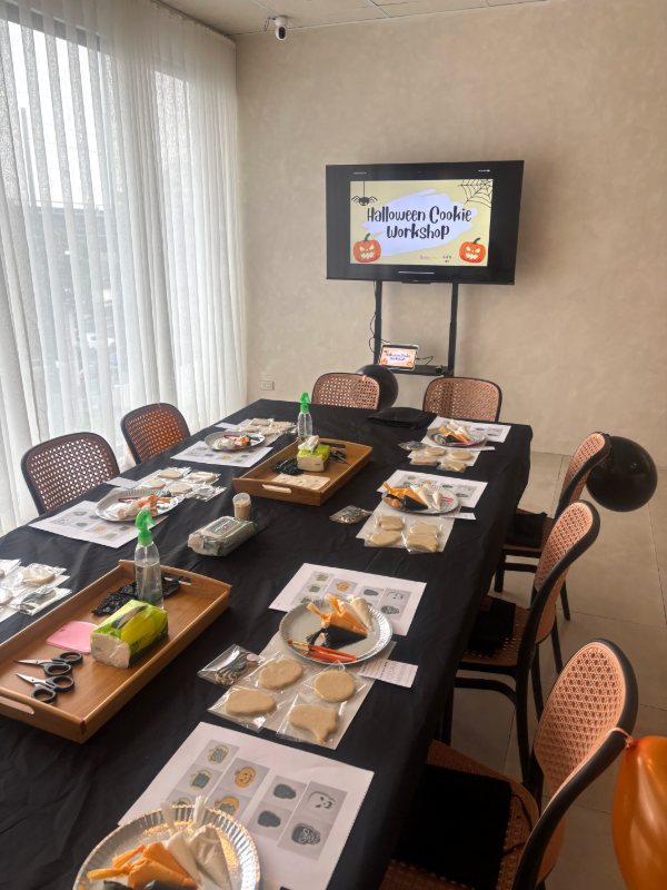 The same session's room, fully set before guests arrive — kits at every seat